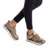 Zapatillas deportivas Xti de color bronce con estampado animal print