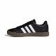 Zapatillas deportivas Adidas negras con bandas en blanco suela de goma marrón - Querol online