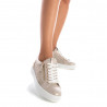 Zapatillas urban Xti doradas con troquel y cremallera lateral