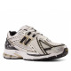 Sabatilles esportives New Balance 1906R metallic silver amb metallic gold per a home - Querol online