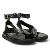 Sandalias planas Querol negras con tachulas y tiras al dedo y tobillo
