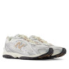 Sabatilles esportives New Balance 204L blanques i platejades amb detalls beix per a dona