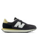 Sabatilles esportives New Balance 237 d'home negres amb detalls blancs i daurats - Querol online