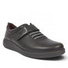 Zapatos planos Treintas en piel negra con cierre de velcro y elásticos decorativos